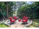 Stone fire pit area offers a cozy outdoor retreat with comfortable seating at 10230 Blackstock Rd, Huntersville, NC 28078