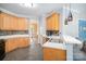 Well-equipped kitchen with ample counter space, wood cabinets, and a view of the dining area at 10230 Blackstock Rd, Huntersville, NC 28078