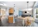 Open kitchen with breakfast bar seating area open to the living and dining areas at 10230 Blackstock Rd, Huntersville, NC 28078