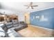 Open-concept living room with a large sectional couch, adjoining the kitchen and dining area for easy entertaining at 10230 Blackstock Rd, Huntersville, NC 28078