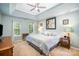 Spacious main bedroom featuring trey ceilings, neutral decor, and bright natural lighting at 10230 Blackstock Rd, Huntersville, NC 28078