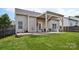 A well-maintained lawn, patio, and pergola make this a great backyard for entertaining at 10303 Dominion Village Dr, Charlotte, NC 28269