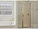Bright bathroom with a separate tub and shower for a spa-like experience at 10303 Dominion Village Dr, Charlotte, NC 28269