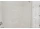 Clean, bright shower tub combination with tile surround and white door at 10303 Dominion Village Dr, Charlotte, NC 28269