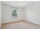 Neutral bedroom with carpet and window with coverings for natural light at 10303 Dominion Village Dr, Charlotte, NC 28269