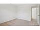 Neutral bedroom with carpet and adjacent room access at 10303 Dominion Village Dr, Charlotte, NC 28269