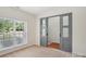 Bright bedroom with large window and modern sliding doors at 10303 Dominion Village Dr, Charlotte, NC 28269