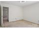 Neutral bedroom with carpet and access to hallway at 10303 Dominion Village Dr, Charlotte, NC 28269