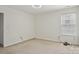 Neutral bedroom with carpet and window with coverings at 10303 Dominion Village Dr, Charlotte, NC 28269