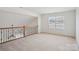 Spacious bonus room with natural light offers flexibility for various uses at 10303 Dominion Village Dr, Charlotte, NC 28269