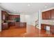 Well-equipped kitchen with dark cabinets, granite countertops, and stainless steel appliances at 10303 Dominion Village Dr, Charlotte, NC 28269