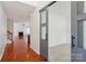 Spacious living room with hardwood floors, a fireplace, and modern sliding doors at 10303 Dominion Village Dr, Charlotte, NC 28269