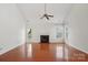 Bright living room with hardwood floors and a cozy fireplace, perfect for relaxing at 10303 Dominion Village Dr, Charlotte, NC 28269