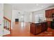 Inviting living room featuring hardwood floors, vaulted ceiling, fireplace and bright windows overlooking the front yard at 10303 Dominion Village Dr, Charlotte, NC 28269