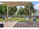 Inviting brick patio with pergola and seating offers a great outdoor space at 10303 Dominion Village Dr, Charlotte, NC 28269