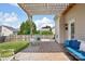 Seating on the brick patio, complete with a pergola, offers comfortable outdoor living at 10303 Dominion Village Dr, Charlotte, NC 28269