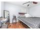 Comfortable bedroom with hardwood floors, a ceiling fan, and good natural light, ready for relaxation at 1033 Rollingwood Dr, Charlotte, NC 28217