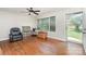 Bright living room featuring hardwood floors, large windows, and neutral walls that enhance the natural light at 1033 Rollingwood Dr, Charlotte, NC 28217