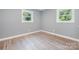 Cozy bedroom featuring fresh paint, hardwood floors, and abundant natural light at 1048 Shenandoah Dr, Gastonia, NC 28052