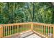 New wooden deck overlooking a backyard with lush green trees at 1048 Shenandoah Dr, Gastonia, NC 28052