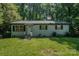 Charming single-story home with brick facade, black shutters and an inviting front yard at 1048 Shenandoah Dr, Gastonia, NC 28052