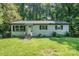 Charming single-story home with brick facade, black shutters and an inviting front yard at 1048 Shenandoah Dr, Gastonia, NC 28052