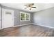Bright living room featuring fresh paint, hardwood floors, and abundant natural light at 1048 Shenandoah Dr, Gastonia, NC 28052