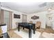 Bright game room features a foosball table and comfortable seating at 12822 Plumleaf Dr, Charlotte, NC 28213