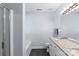 Bright bathroom with double granite vanity, shower, separate tub, black tile floor and a large, well lit mirror at 13517 Silver King Ct, Huntersville, NC 28078