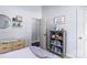 Cozy bedroom with a bookshelf, dresser and an open door to another room, offering ample storage and living space at 13517 Silver King Ct, Huntersville, NC 28078
