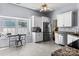 Bright kitchen area features tile floors, stainless appliances, and a cozy breakfast nook at 13517 Silver King Ct, Huntersville, NC 28078