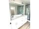Modern bathroom boasts dual sinks, quartz countertop, walk-in shower with stylish tile, and modern fixtures at 1683 Interstate View Dr, Gastonia, NC 28052