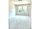 This bedroom features neutral walls, carpet, and two windows, providing ample natural light and a cozy atmosphere at 1683 Interstate View Dr, Gastonia, NC 28052