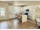 Modern kitchen with white cabinetry, stainless steel appliances, an island with seating, and natural light from a window at 1683 Interstate View Dr, Gastonia, NC 28052