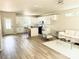 Spacious living area featuring an open floor plan, connecting the modern kitchen with a bright and inviting living space at 1683 Interstate View Dr, Gastonia, NC 28052