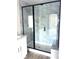 Modern tiled shower features a sleek glass enclosure, a built-in seat, and elegant gray and white accents at 1683 Interstate View Dr, Gastonia, NC 28052