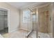 Bathroom with frameless glass shower and a window offering natural light at 17514 Harbor Walk Dr, Cornelius, NC 28031