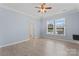 Spacious bedroom with hardwood floors, ceiling fan, two windows, and neutral walls at 17514 Harbor Walk Dr, Cornelius, NC 28031