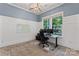 Office with a work space, wainscoting, modern lighting, a rug, and plenty of natural light at 17514 Harbor Walk Dr, Cornelius, NC 28031