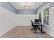 Office featuring modern lighting, wainscoting, a work space, and plenty of natural light at 17514 Harbor Walk Dr, Cornelius, NC 28031