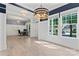 Spacious office featuring modern lighting, wainscoting, and large windows for plenty of natural light at 17514 Harbor Walk Dr, Cornelius, NC 28031