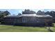 Brick home with solar panels, deck, and large backyard at 3080 Shue Rd, Salisbury, NC 28147
