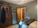This bedroom features warm wood tones in its closet and paneled door at 3080 Shue Rd, Salisbury, NC 28147