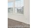 Bright and spacious bedroom with neutral carpet and ample natural light from the two windows at 4044 Beacon Ave # 152, Monroe, NC 28110