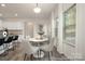 Bright dining nook with modern table, chairs, and natural light at 4044 Beacon Ave # 152, Monroe, NC 28110