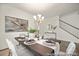 Dining room with elegant decor and a stairway at 4044 Beacon Ave # 152, Monroe, NC 28110