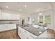 Open kitchen with stainless appliances, granite counters, and an eat-in dining area at 4044 Beacon Ave # 152, Monroe, NC 28110