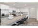 Bright kitchen with a large island, stainless appliances, and ample cabinet space at 4044 Beacon Ave # 152, Monroe, NC 28110