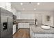 Spacious kitchen featuring stainless steel appliances, a large island, and modern cabinetry at 4044 Beacon Ave # 152, Monroe, NC 28110