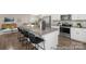 Modern kitchen featuring stainless steel appliances and a spacious island with seating at 4044 Beacon Ave # 152, Monroe, NC 28110